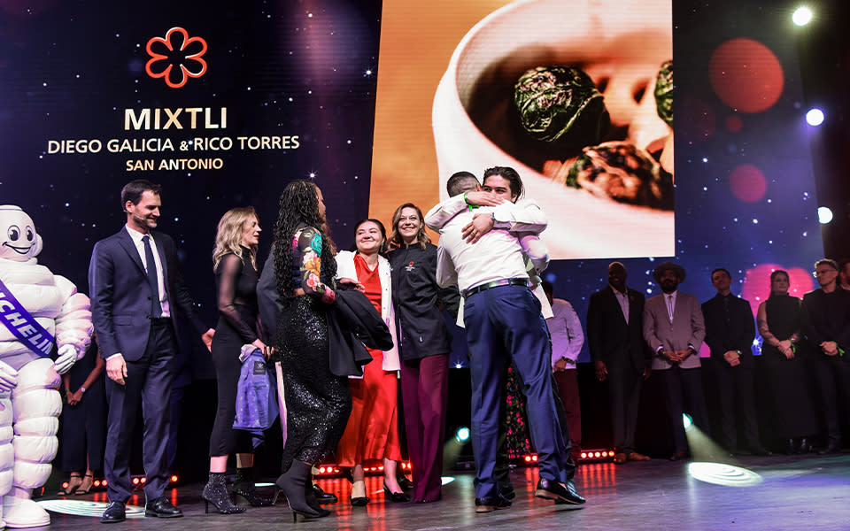 Men hugging at MICHELIN Award Show
