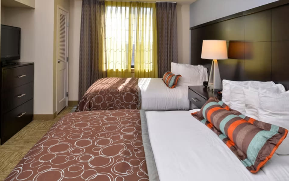Two hotel beds at Staybridge Suites San Antonio - Stone Oak
