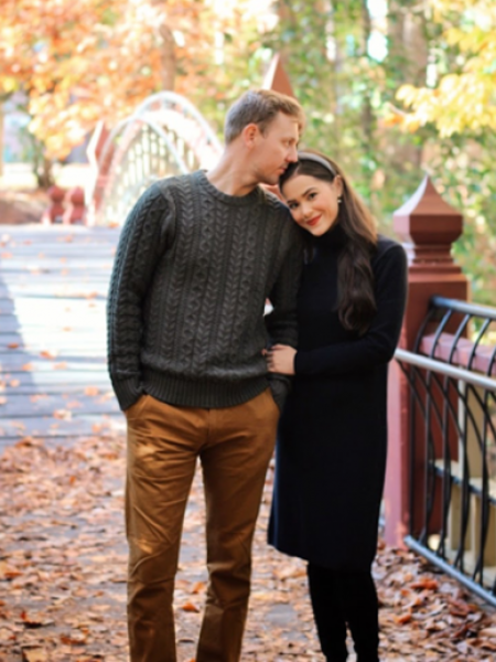 Couple kissing on a bridge