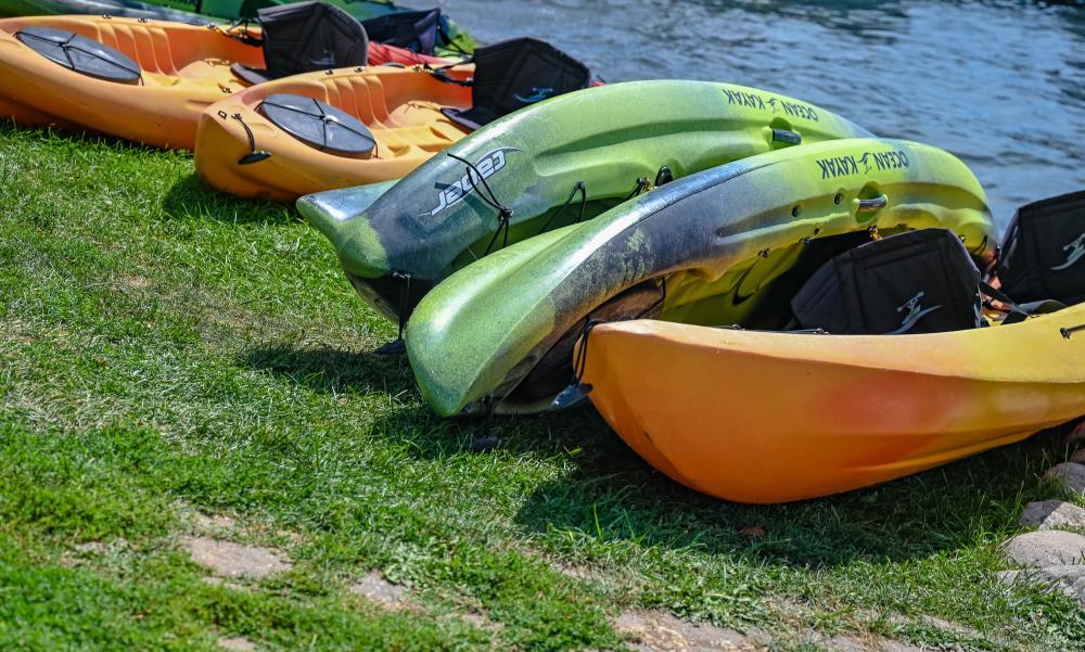 Kayaks laying on the lakeshore