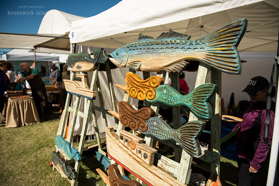 decorative wooden signs for sale at the vendor stalls at the nc oyster festival