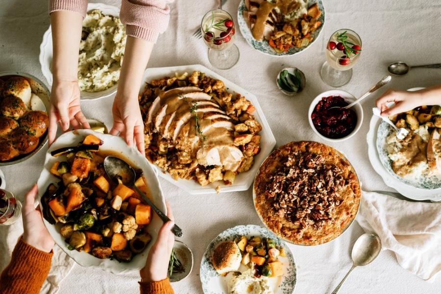 Table with Thanksgiving classics like turkey and pie