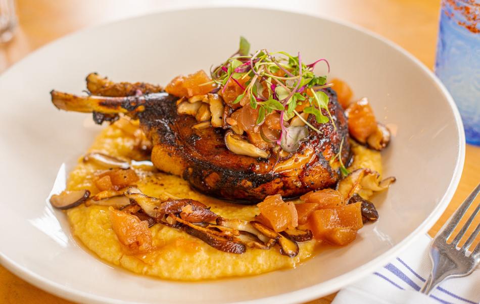 double bone in Berkshire pork chop with our cheesy poblano grits