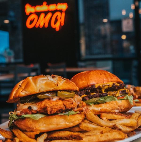 Chicken and beef burgers with fries at OMG Burger