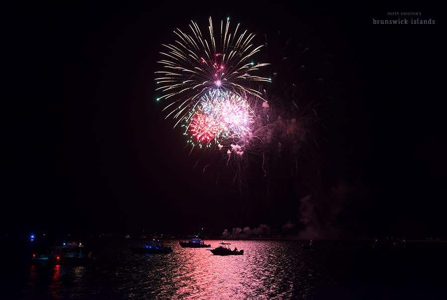 fireworks over a body of water during the NC 4th of July Festival in Southport, NC