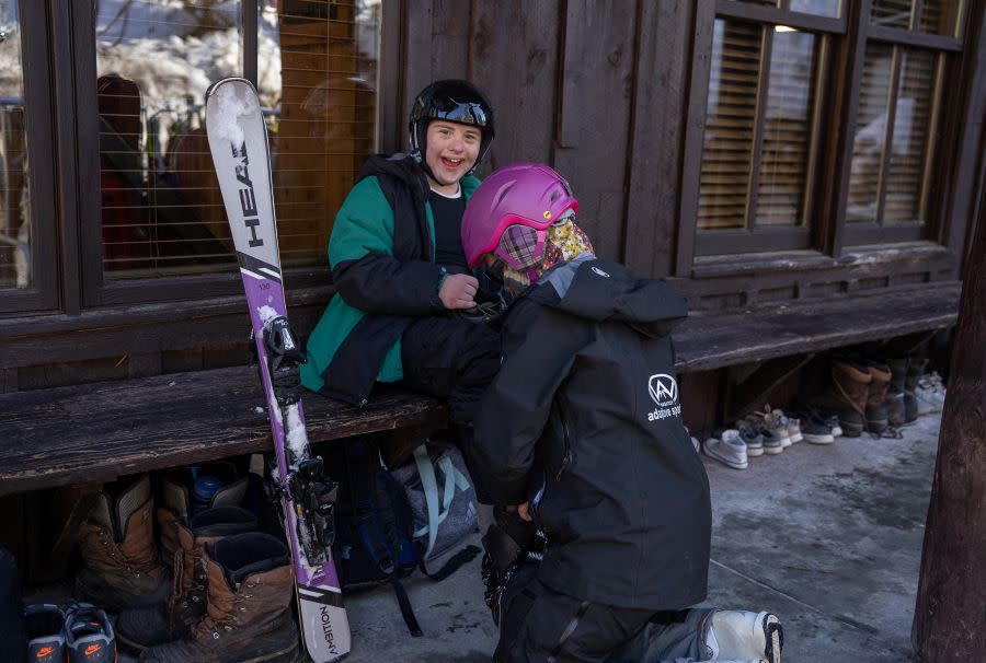 Jodi assisting chase with ski equipment at Sundance