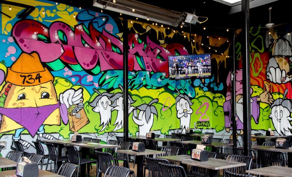 Condado Tacos mural indoors graffiti style