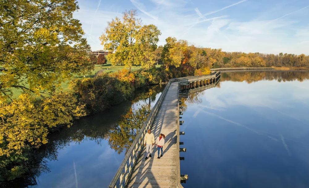 couple walks at North bay park in ypsilanti