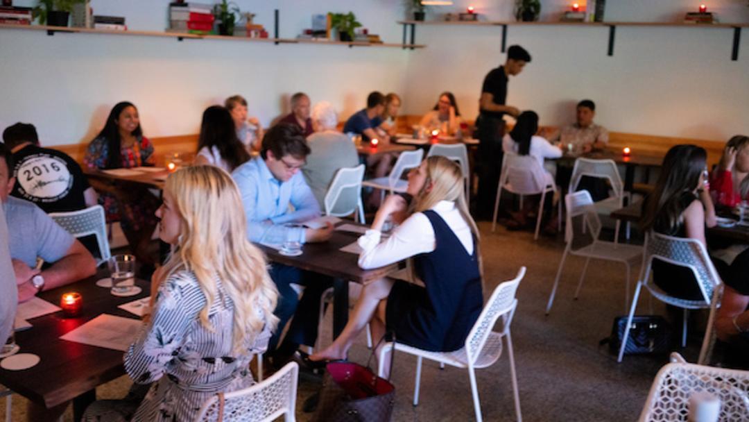 People dining at Night Heron in Houston's Montrose neighborhood