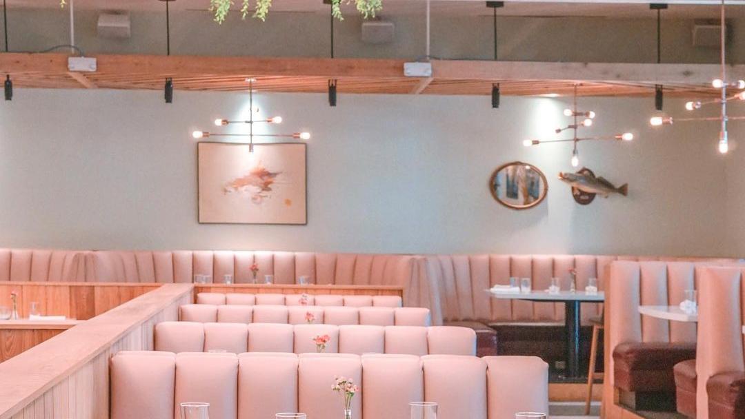 Pink seating booths inside the Indianola restaurant