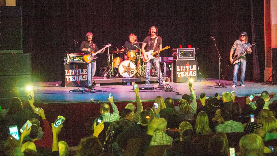 Little Texas Band performing on state in front of an audience in Conroe, Texas