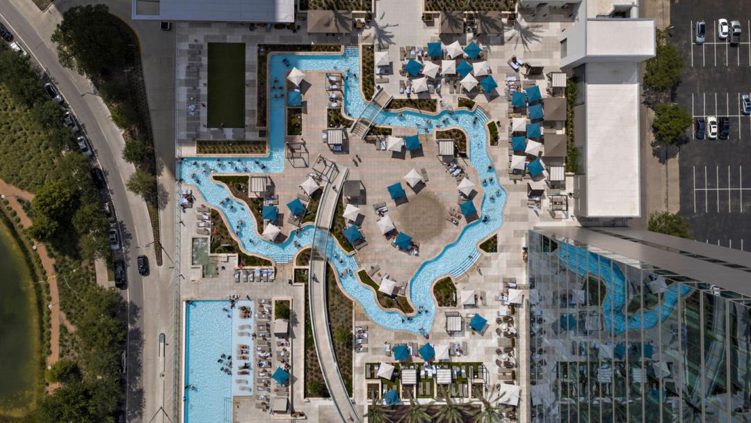MMH Hotel features a pool and a lazy river in the outline of the state of Texas.