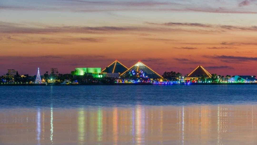 View of Moody Gardens with Christmas lights across the water near Houston