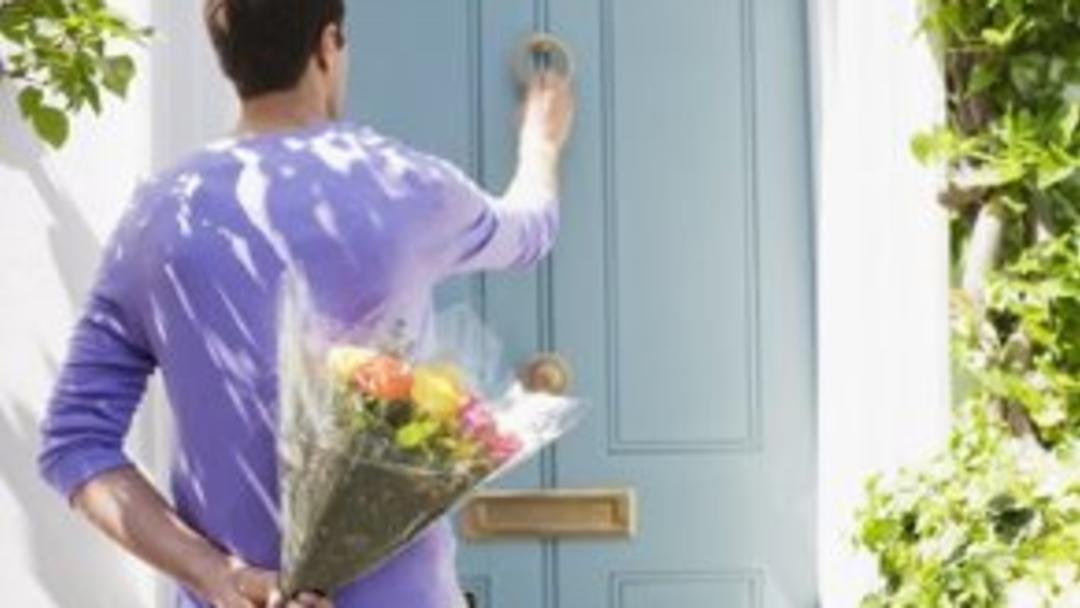 man holding flowers