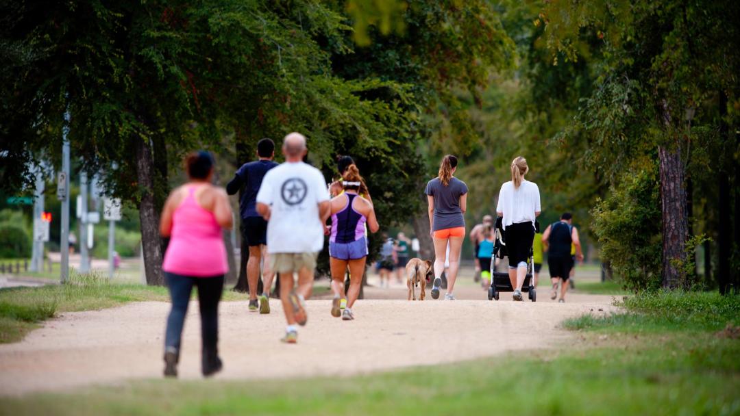 People Walking In Memorial Park In Houston, TX