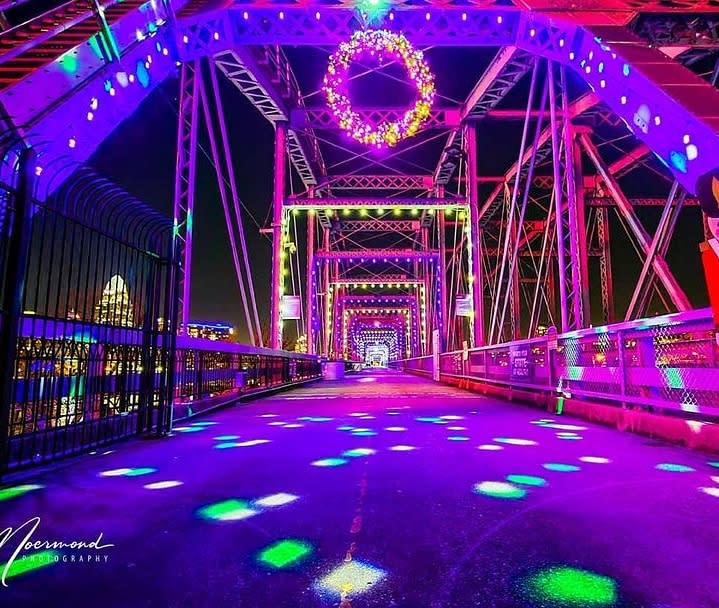The Purple People bridge that leads from Cincinnati, Oh to Newport, Ky lit up in purple, green, white and pink lights for the holiday season