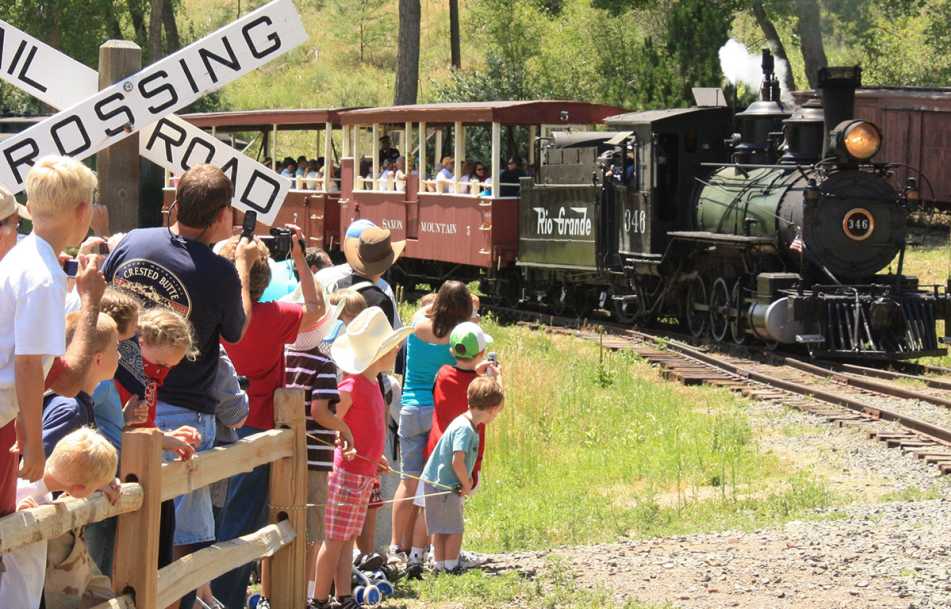 Train on a track before crowd at Colorado Railroad Museum