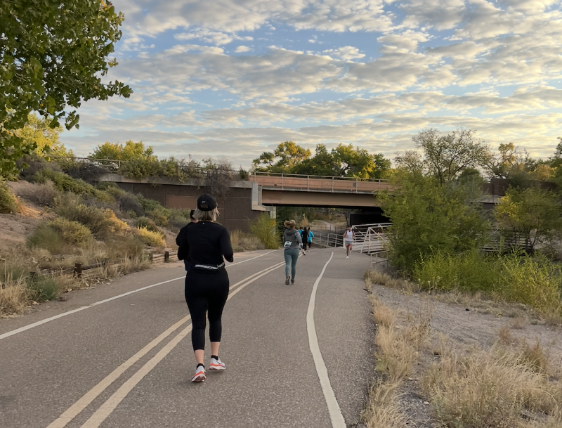 Some runners run on a trail along the Bosque during a Balloon Fiesta run.