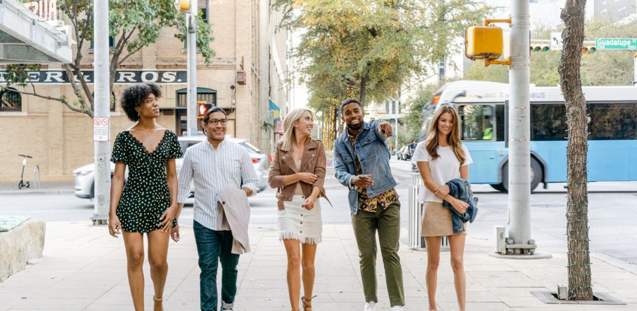 Group of friends walking through 2ND Street District in downtown Austin Texas