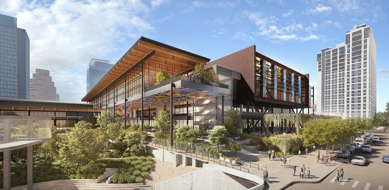 Austin Convention Center rendering shows the new building from street level, looking towards the East Entrance. Pedestrians cross the street, with Hilton Austin Hotel in the background and Waller Creek  with trees, native plants and a creek-side walkway in the foreground.