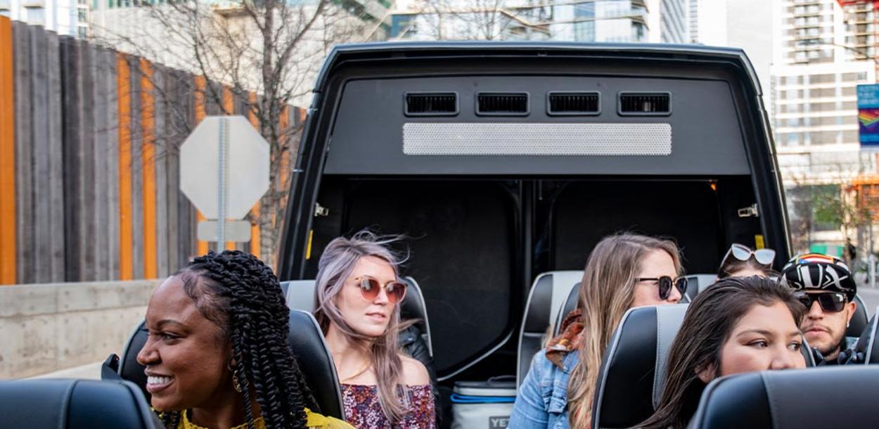 People sitting in open top van on an AO Tour in Austin Texas