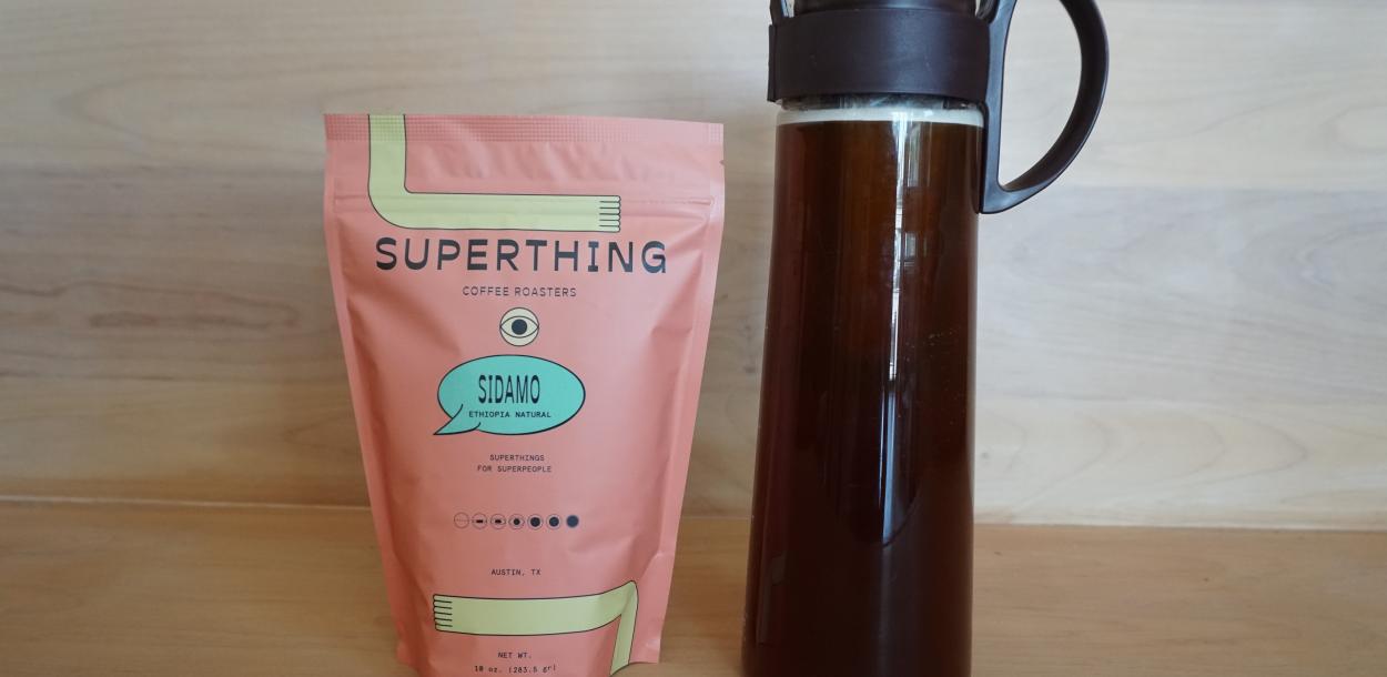 Bag of Superthing Coffee next to cold brew coffee from Patika in Austin Texas