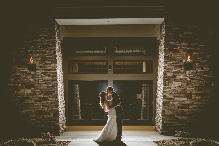 Embrace at entrance by  Wallflower Photography