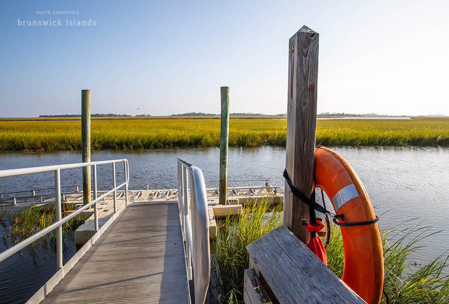a ramp leading down to a small dock and kayak ramp on Bald Head Island