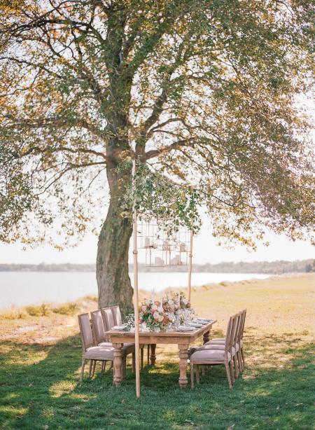 A table is set for a wedding reception by the shores of the Chesapeake Bay.