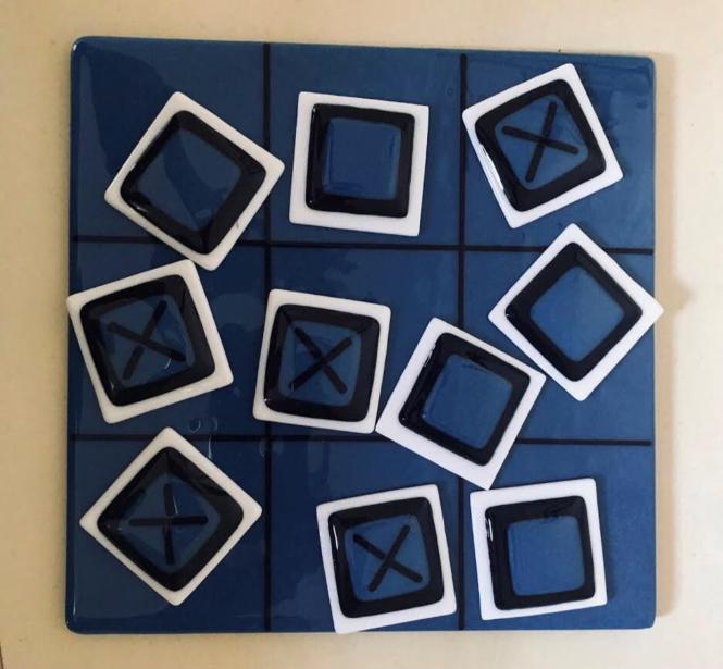 A glassworks tic, tac, toe set.