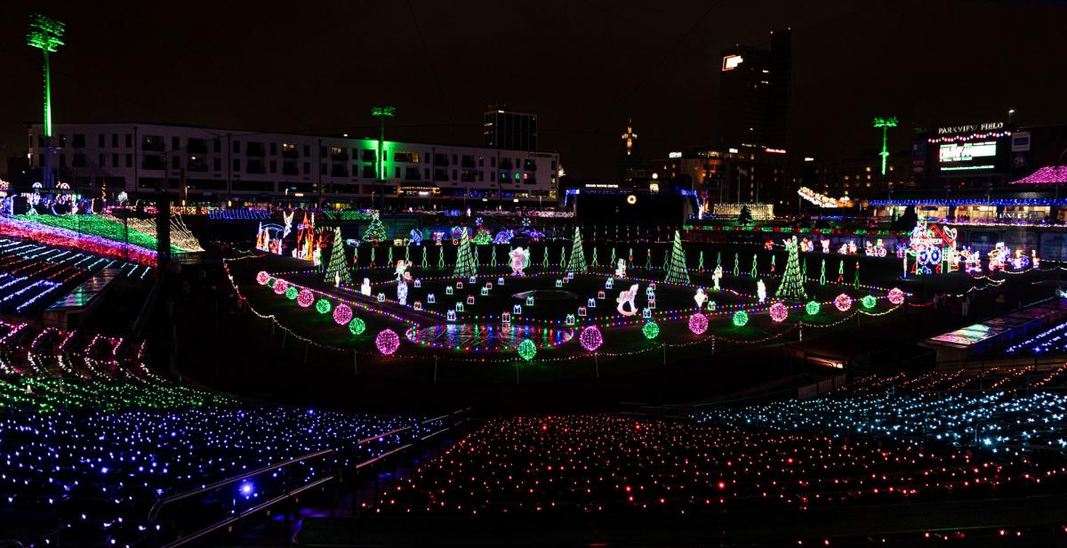 Festive holiday lights illuminate Parkview Field in downtown Fort Wayne, highlighting the stadium's architecture and creating a vibrant seasonal atmosphere.