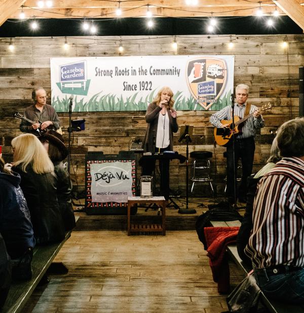 band performing in front of sitting customers