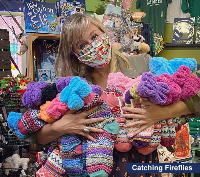 Catching Fireflies salesperson with mask and fuzzy socks