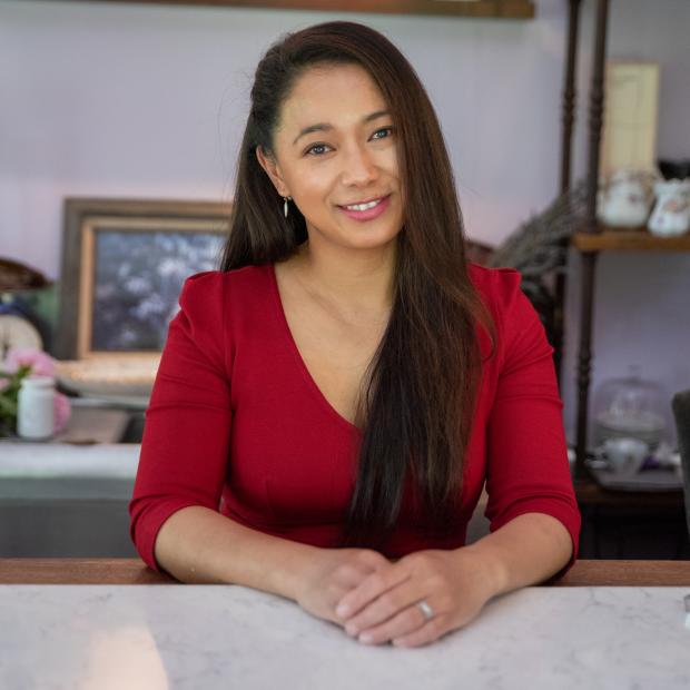 Claire Benjamin, Owner of Rue Clair Chocolates behind tasting counter