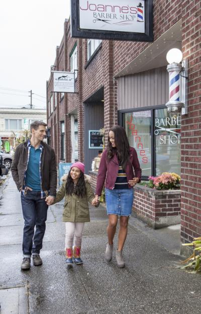 Mother, Father and Daughter Windows shopping in Sumner, Washington