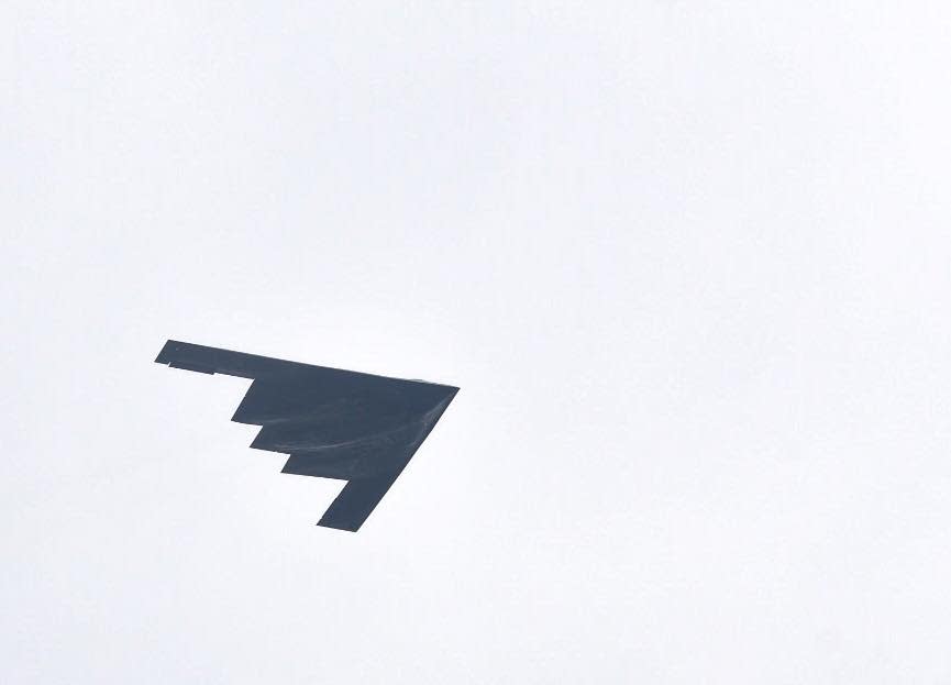 A B-2 Spirit from Whiteman Air Force Base performs a flyover at the Frontiers in Flight Air Show and Open House at McConnell Air Force Base