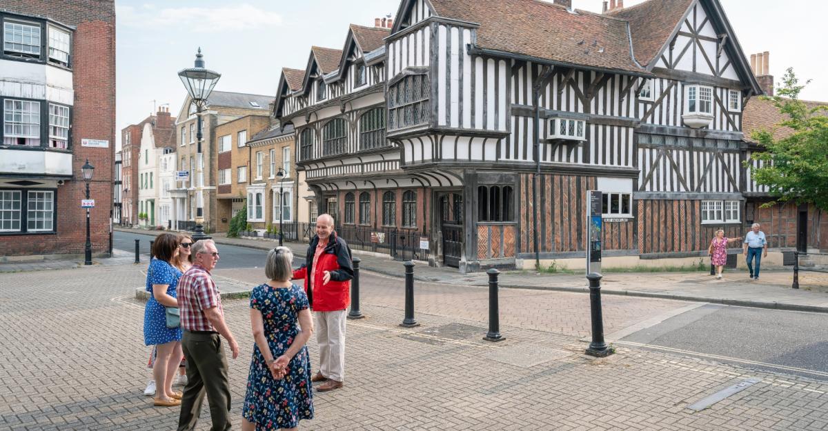 See Southampton Tour guide talking to small group of people outside Tudor House & Garden