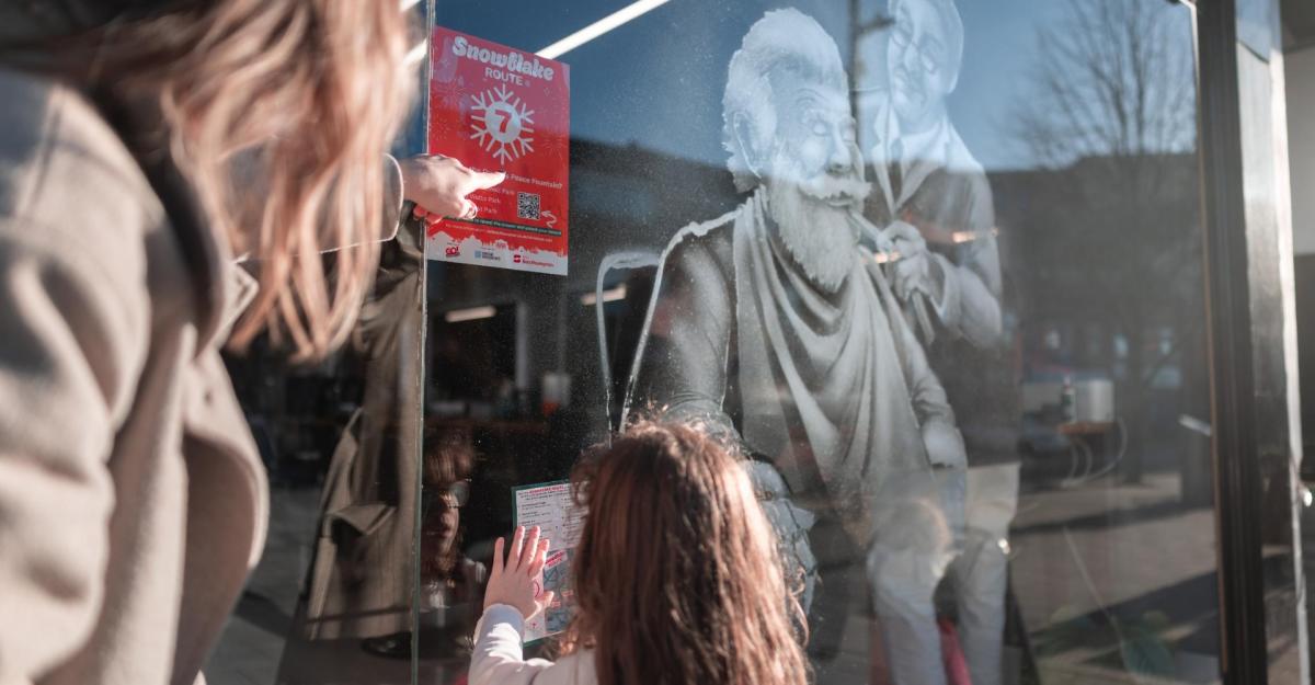 Snow windows display of santa having a shave by a barber