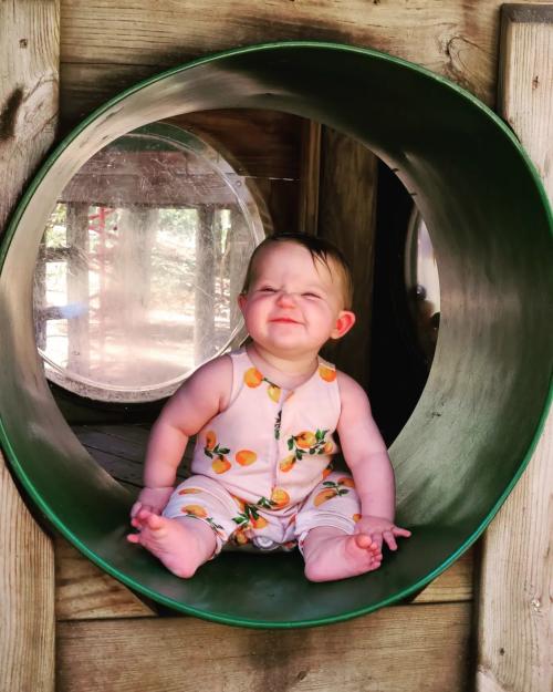 Baby playing on playground at Robert Lake Park