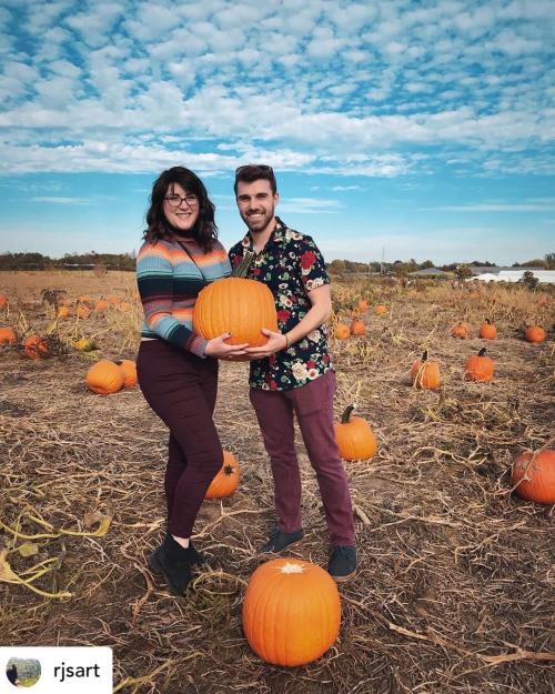 Couple with pumpkin U-Pick pumpkins at Huber’s Orchard, Winery & Vineyards.