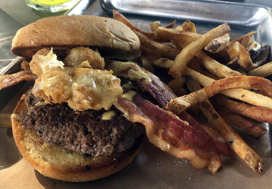 burger with cheese tots, bacon and fries