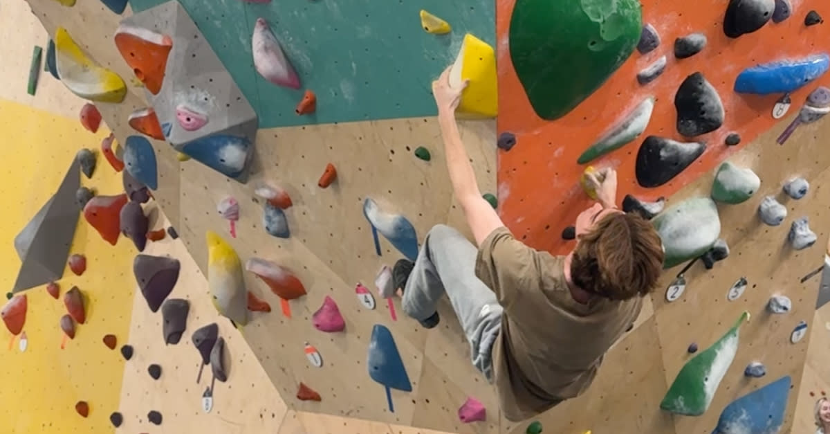 A guy scales a very impressive wall at Armadillo Boulders in San Marcos, Texas