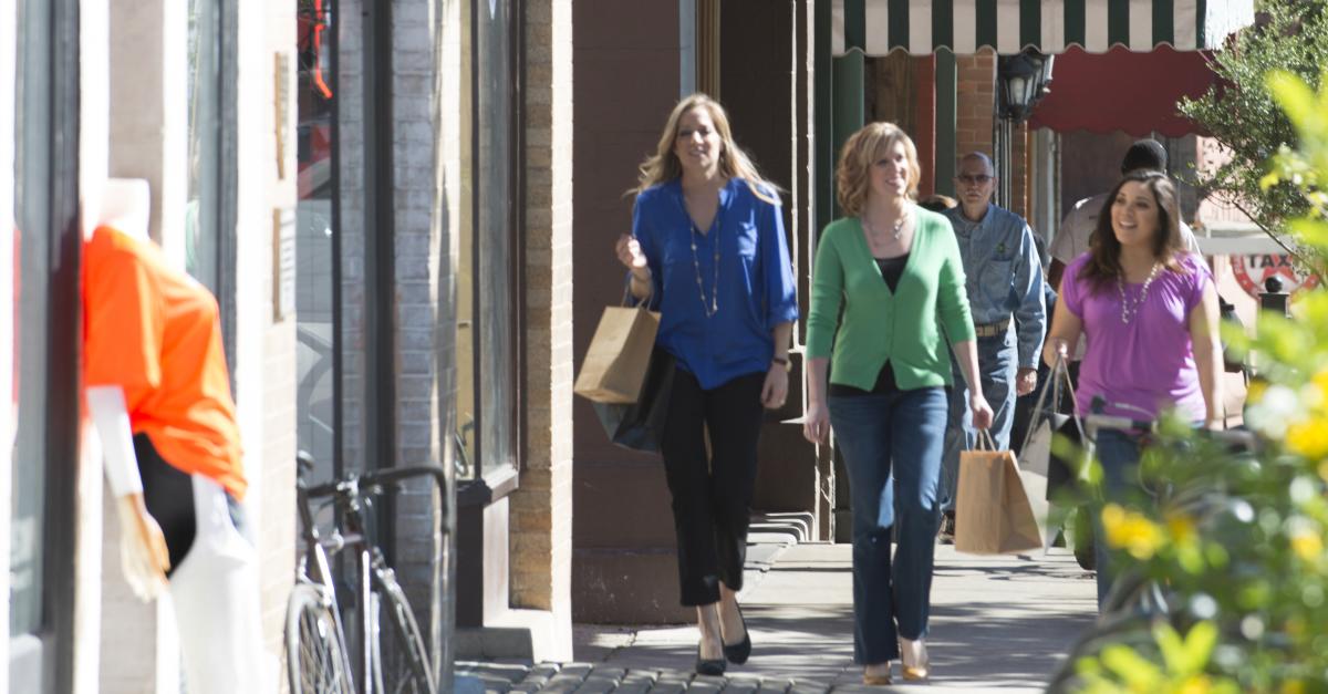 Three women with shopping bags