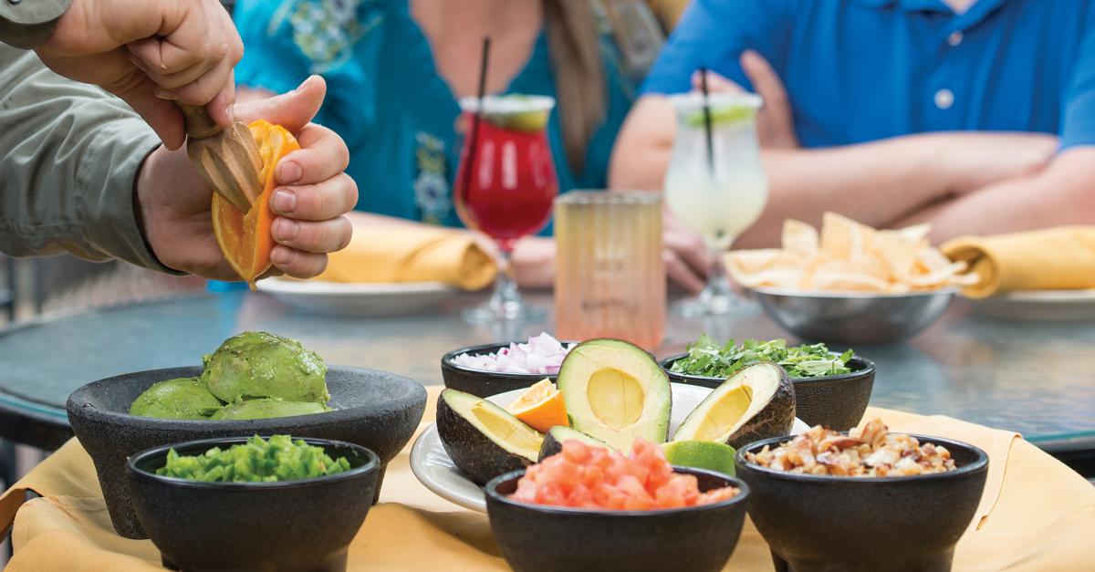 Server making tableside guacamole