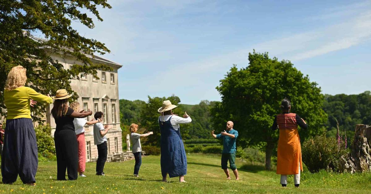 group taking place in the grounds of sharpham trust