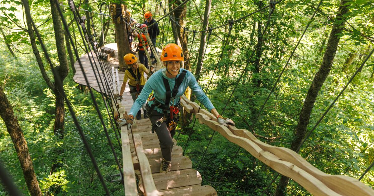 A group crossing a bridge at Boone Creek