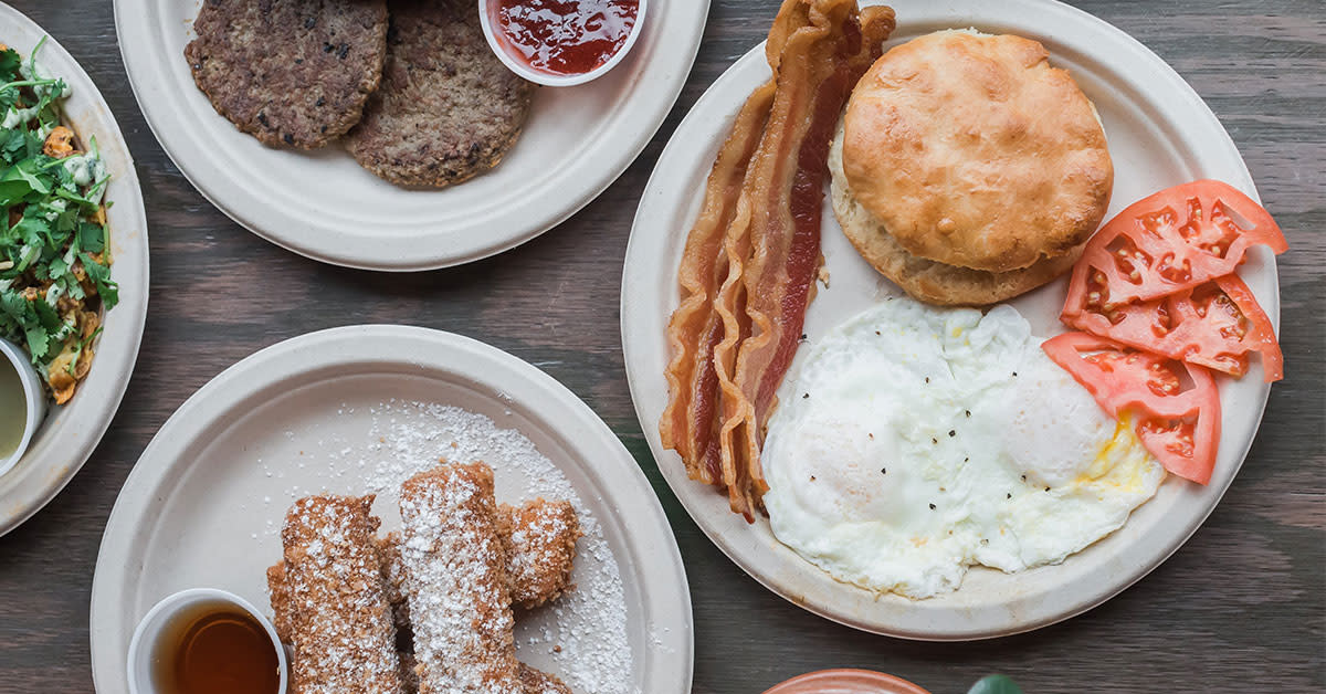 four plates of breakfast food entrees from DV8 in Lexington Kentucky.