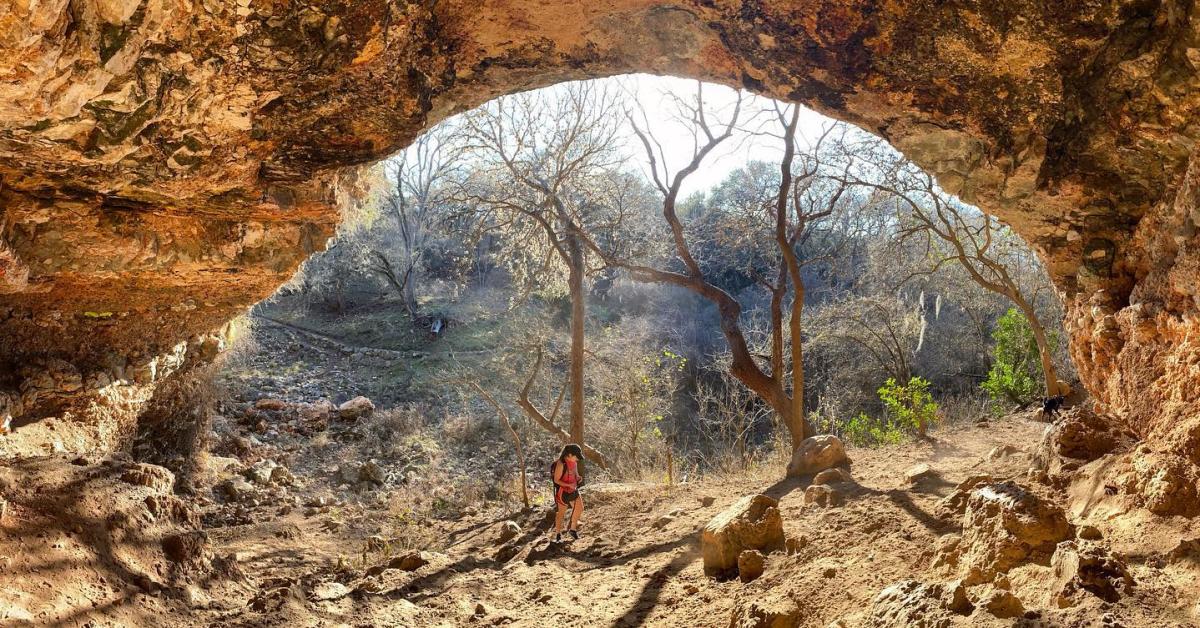 Hiker exploring Upper Purgatory Creek Natural Area