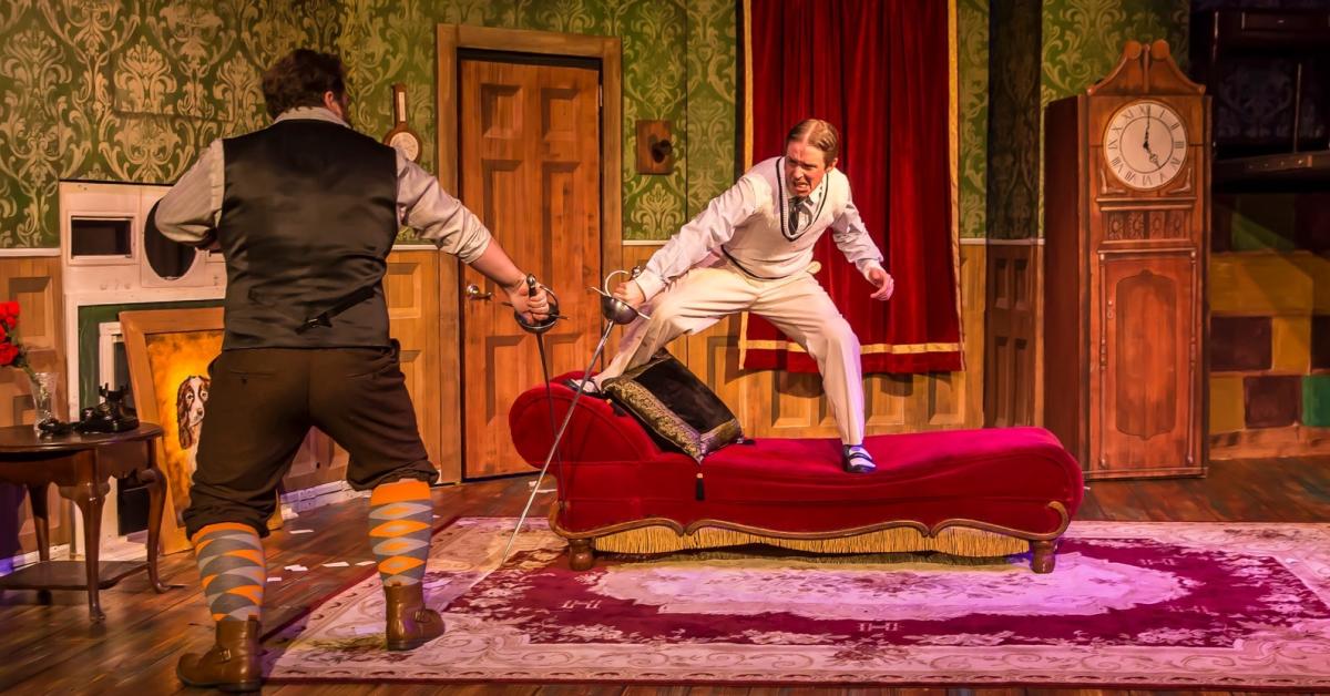 Two actors perform during "The Play That Goes Wrong" at Roxy's Downtown.