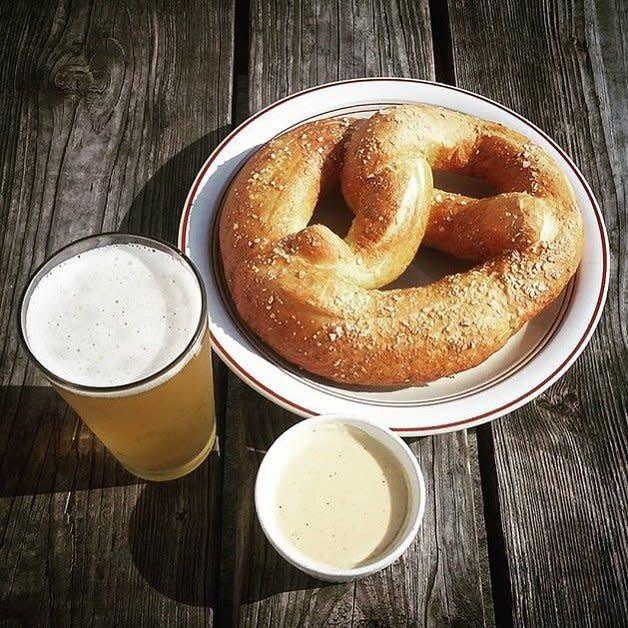 A huge german pretzel and beer cheese and beer at Wunderbar in Covington, KY